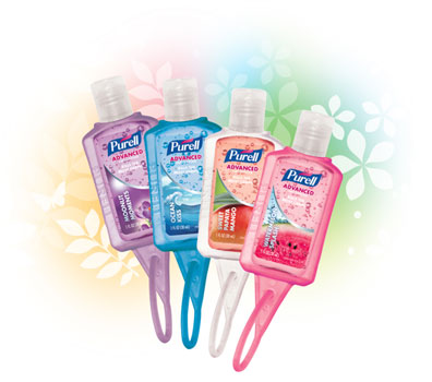 4 Multi colored bottles of purell hand sanitizer