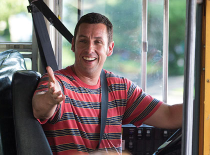 Adam Sandler driving a bus